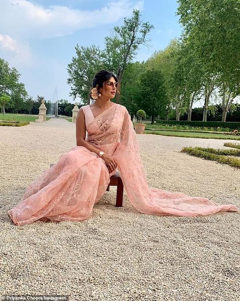 The Indian 37-year-old  captioned her Throwback Thursday post: 'It's my go-to for every special occasion! Thank you [designer Sabyasachi Mukherjee] for flying down the six yards of love and big hug to [style strategist Ami Patel] for making it happen' Pink Sari, Sabyasachi Sarees, Wedding Party Outfits, White Wedding Gowns, Stylish Sarees, Indian Sari, Saree Look, Priyanka Chopra, Pink Saree