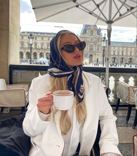 Coffee, girl in Paris, hot chocolate, silk scarf, sunglasses, Parisian style, blonde hair, blonde girl Coffee In Paris, Paris Louvre, France Outfits, Morning Aesthetic, Louvre Paris, Square Scarf, Silk Scarves, Parisian Style, Old Money