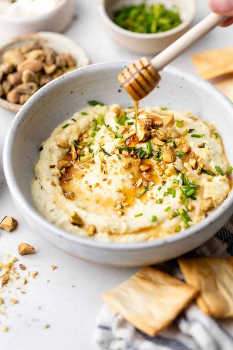 Dive into a blend of savory and sweet flavors with this incredible Baked Hot Honey Feta Dip recipe. Made with feta, cream cheese, hot honey, pistachios, and chives, it's perfect for game day or enjoying as a flavorful appetizer! Feta Honey Dip, Hot Honey Goat Cheese Dip, Whipped Feta With Hot Honey, Honey Feta Dip, Honey Feta, Honey Appetizers, Cauliflower Dip, Goat Cheese Dip, Filling Snacks