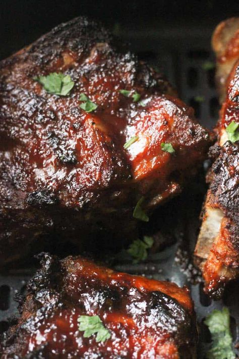 These air fryer neck bones are melt-in-your-mouth tender. Made with pork neck bones, BBQ sauce, ground paprika, and garlic powder these sweet, smoky, and sticky neck bones are the ultimate comfort meal! Fried Neckbones, Smoked Neck Bones, Neck Bones Recipe, Pork Neck Bones Recipe Slow Cooker, Smoked Neckbones Recipes, Beef Neck Bones Recipe Soul Food, Pork Neckbones Recipes, Pork Neck Recipes, Neck Bones Recipe Soul Food