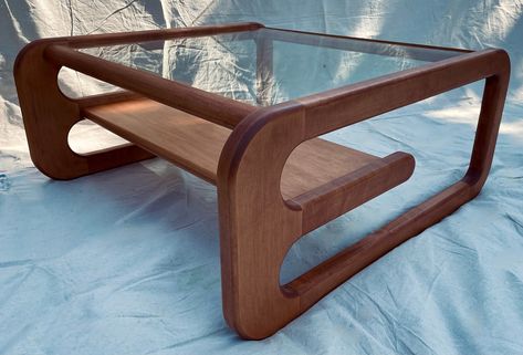 "Made out of locally sourced solid wood, this mid century inspired coffee table will bring a touch of elegance to any room. Constructed with longevity in mind this table will last generations.  Comes in solid Cherry, Maple or Walnut. Walnut is protected with a natural stain to show off the natural beauty of walnut and the cherry/maple can be stained to many options. Example shown is solid maple with a mahogany finish. Measures 36\"x36\"x16\". This item ships via courier and shipping quotes will be available upon request due to the size and shape, prices range from $50 - $200 for domestic shipping and $100 - $350 for international.  Unit comes flat packed and requires assembly." Mid Century Coffee Table Decor, Coffee Table Mid Century, Plant Coffee Table, Vintage Tables, Wavy Coffee Table, Cool Coffee Table, Retro Coffee Table, Retro Wood Coffee Table, Coffee Tables