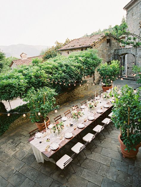 For dinner, guests gathered at a long table in the lower courtyard of the villa. String lights, a stunning tablescape, and music by the string duo catered to the intimately romantic atmosphere. Intimate Destination Wedding, Wedding In Tuscany, Outdoor Wedding Reception, Outdoor Reception, Martha Stewart Weddings, Tuscany Wedding, Wedding Destination, Italian Wedding, Destination Wedding Photography