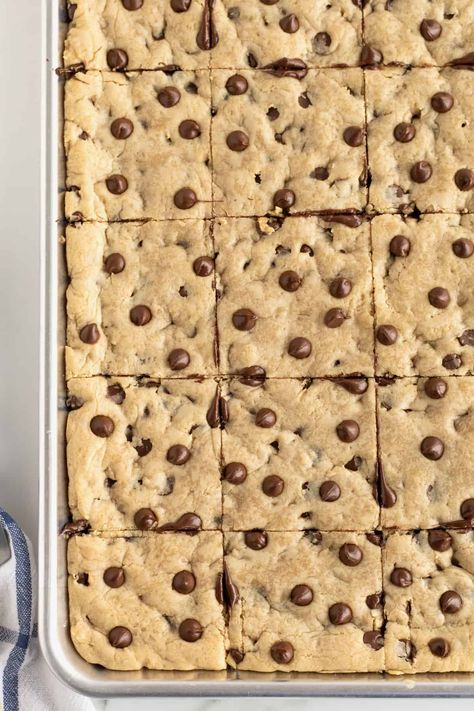 Sheet Pan Chocolate Chip Cookie Bars by The BakerMama Sheet Cake Cookie Bars, Sheet Cookie Bars, Chocolate Chip Cookie Bars Sheet Pan, Sheet Pan Bars Cookie Recipes, Chocolate Chip Pan Chewies 12 Tomatoes, Sheet Pan Blondies, Sheet Pan Chocolate Chip Cookies, Sheet Cake Desserts For A Crowd, Sheet Pan Chocolate Chip Cookie Bars