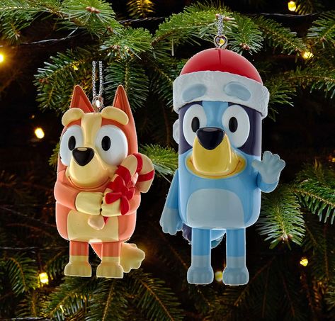 Kurt Adler is proud to welcome the International Emmy Award winning children's character Bluey to our family of unique licensed Christmas ornaments. This Bluey and Bingo ornament set from Kurt Adler is a fun and festive addition to your holiday décor or Christmas tree. Included in this set are Bluey and sister Bingo, each with festive Santa hat and candy cane. Made of plastic and paint/mica. Bluey approx 3.3" tall and Bingo 2.5" This content contains an affiliate link. #ad Sister Bingo, Blue Heeler Puppy, Heeler Puppy, Blue Heeler Puppies, Heeler Puppies, Bluey And Bingo, Bluey Bingo, Kurt Adler, Disney Holiday