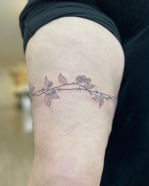 40 • the biggest wrap around i’ve done so far! a cool barbed wire and blackberry vine for Xanthe 🍇💜 so keen for your next appointment 🫶🏻 - DM for booking enquiries, currently booking august! apprentice rates - - #customtattoo #tattoo #tattooapprentice #tattooapprenticeship #tattooart #melbournetattoo #aussietattoo #aussieartist #wraparound #wraparoundtattoo #barbedwiretattoo Barbwire And Flowers Tattoo, Barb Wire Collar Bone Tattoo, Barbwire Tattoo Arm, Wrap Around Bicep Tattoo Women, Wrap Around Arm Tattoo, Barbwire Tattoo, Blackberry Vine, Bicep Tattoo Women, Barbed Wire Tattoo