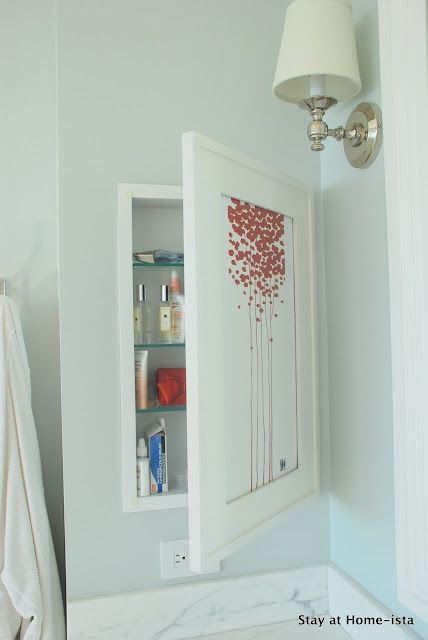 Add extra storage in the bath by concealing a second medicine cabinet behind some artwork Hidden Medicine Cabinet, Diy Bathroom Storage, Medicine Cabinets, Up House, Trendy Bathroom, Bathroom Redo, Medicine Cabinet Mirror, Stylish Bathroom, Bathroom Renos