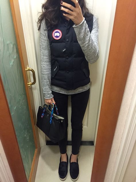 Canada Goose freestyle vest, H&M knitted top, UNIQLO skinny jeans, Steve Madden pony hair slip on, Hermes Garden Party TPM. Canada Goose Vest Women Outfit, Canada Goose Vest Outfit, Canada Goose Outfit, Vest Women Outfit, Canada Goose Vest, Goose Outfits, Hermes Garden Party, Vest Outfit, Clothing Aesthetic