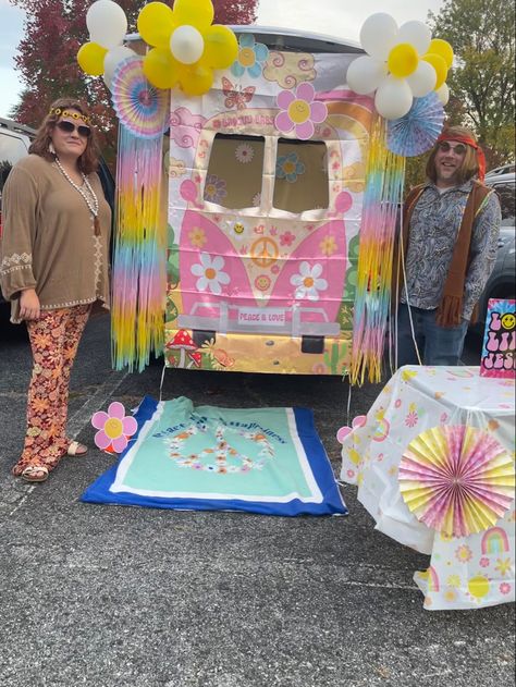 Photo prop from Amazon was taped to front of our vans trunk gate. Put a sheet behind it in the van with some decor taped to it due to the cut outs. Fringe backdrop taped around sides of gate were from Five Below (cheaper and longer than others I found). Then I made Balloon flowers/daisies, and used other themed decor I found from Hobby Lobby and Five below. Disco Trunk Or Treat Ideas For Cars, 70s Theme Trunk Or Treat Ideas, 60s Trunk Or Treat Theme, Hippy Trunk Or Treat Ideas, 70s Trunk Or Treat Ideas, Trunk Or Treat 70s Theme, Groovy Trunk Or Treat, Hippie Trunk Or Treat Ideas, Hippy Theme Trunk Or Treat