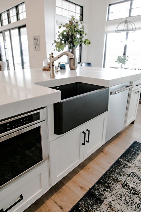 Black Farmhouse Sink. I topped the kitchen off with gorgeous, easy to maintain, marble look, quartz countertops. We used an extra thick 6cm quartz, with a mitered edge, to give the countertops a substantial look. My favorite feature may be the black silgranit, farmhouse sink from Blanco. The black sink, with brass faucet, set agains the white countertops and cabinetry is an absolute showstopper! #BlackFarmhouseSink #BlackSink #FarmhouseSink Sita Montgomery Interiors Black Farmhouse Sink, Farmhouse Room, Black Sink, Farmhouse Sink Kitchen, White Countertops, Dining Nook, Modern Farmhouse Kitchens, Farmhouse Sink, Counter Tops