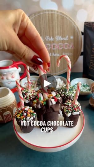 29K views · 491 reactions | HIGHER IN PROTEIN HOT COCOA CHOCOLATE CUPS

Welcome back to episode 12 of @melissas_healthykitchen festive holiday eats series. Today it’s how to make higher in protein, festive hot cocoa chocolate cups. These also make the perfect DIY gift for your friends and family too.

Festive Higher in Protein Hot Chocolate Cups
10 oz no sugar added chocolate chips
1 tsp organic refined coconut oil
1/2 cup vegan mini marshmallows
1 cup @truvani plant based chocolate protein powder
1/4 cup organic cacao powder
1 tsp cinnamon 
Festive sprinkles of choice 
Candy canes

Instructions:
1. Melt your chocolate chips with coconut oil
2. Pour melted chocolate into silicone cup molds. Swirl around and pour excess chocolate back in bowl. Freeze for 10 minutes and repeat a few times to Protein Hot Chocolate, Hot Chocolate Cups, Homemade Chocolate Candy, Refined Coconut Oil, Cocoa Chocolate, Holiday Eating, Chocolate Protein Powder, Hot Chocolate Bars, Melted Chocolate