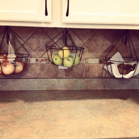 Hanging baskets under cabinet for extra counter space Diy Hanging Fruit Basket Under Cabinet, Under Cabinet Fruit Basket, Under Cabinet Fruit Storage, Bread Basket Ideas, Hanging Baskets Ideas, Kitchen Towel Storage, Mugs Hanging, Kitchen Towels Storage, Cabinet Paper Towel Holder