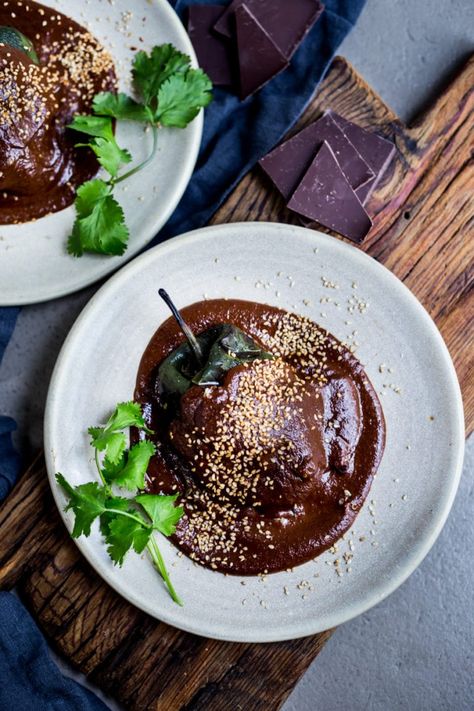 Stuffed Poblano Chili with black beans, quinoa, optional goat cheese- topped with a dark, complex and luscious Mole Negro Sauce. | www.feastingathome.com Black Beans Quinoa, Enchiladas With Black Beans, Chili With Black Beans, Best Quinoa Recipes, Aaron Sanchez, Poblano Chili, Mexican Mole, Christmas Meals, Mole Sauce