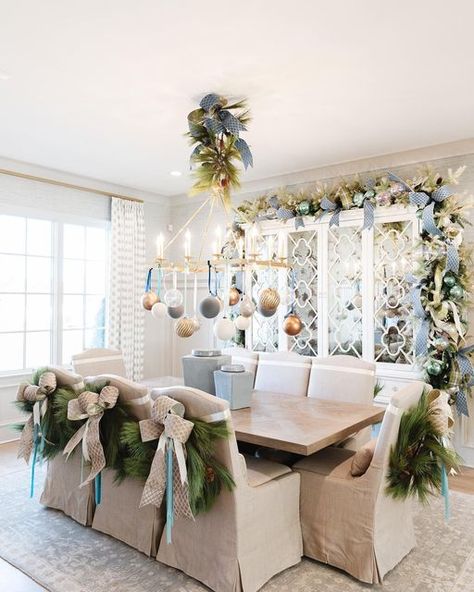 John Mark Sharpe on Instagram: "Merry Christmas from this fabulous dining room! Dress up your chairs with these pine wreaths and a simple bow! You can find them @johnmarkenterprises! Pictures by: @annabellacharles Interior Design by: @warehouse67design Home builder: @johndukehomes Realtor: @elizabethdukerealtor Home Show: @vestahomeshow Magazine: @athomemagazine" Christmas Dining Room Chair Decor, Pine Wreaths, Xmas Recipes, Simple Bow, Chair Bows, Christmas Chair, Christmas Eve Dinner, Christmas Dining Room, Pine Wreath