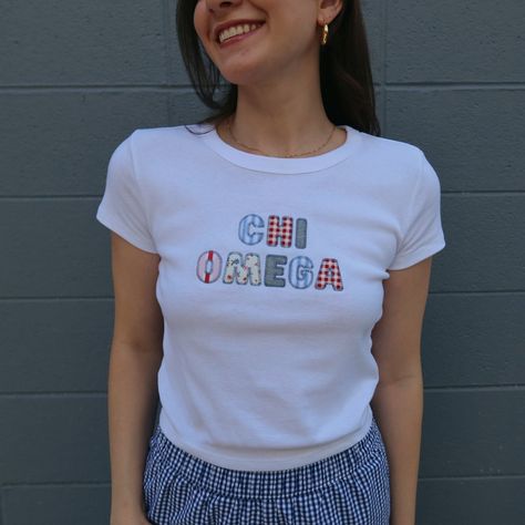 This adorable bella + canvas baby tee is sure to be your next go to tee for recruitment, PR, big little, or just pairing with jeans for class! Your sorority name or nick name will be spelled out (12 character limit) in 5 different fun blue, red & pink fabrics! Each design has the same fabrics, however displayed in a unique pattern each time, no two baby tees will be the same! The model is a 4, wearing a size small white baby tee. Bulk order pricing available, reach out to us via email info@thele Sorority Patchwork Shirt, Sorority Shirt Ideas, Sorority Merch Apparel Design, Sorority Merch Ideas, Big Little Themes, Panhellenic Shirts, Theta Merch, Big Little Reveal Themes, Sorority Tshirt Designs