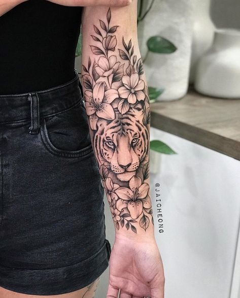 Full Sleeve Tattoos Women Tiger, Tiger Flower Sleeve Tattoo, What Does A Tiger Tattoo Represent, Tiger And Flower Tattoo Half Sleeves, Tiger And Bear Tattoo, Half Sleeve Tattoos For Women Upper Arm Tiger, Tiger And Flower Tattoo For Women, Tiger Tattoo Flowers, Pretty Animal Tattoos