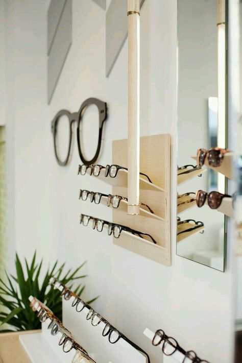 Falken Reynolds, Display Visual Merchandising, Eyewear Store Design, Optometry Office, Heritage Building, Eyewear Display, Eyeglass Stores, Sunglasses Display, Chevron Wall