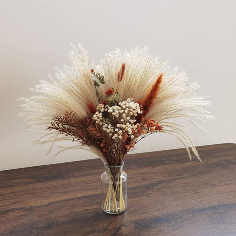 PRICES MAY VARY. A cute bouquet of dried flowers, to for so many different occasions,wedding,party,Birthday, mother's day, gifts, etc.Provide customized services! Bouquet size :17 inches long and 14-16 inches wide Vase Dimensions: 5.5" H, 3.5" W, Diameter: 2" Due to the nature of dried and preserved flowers please take extra care in handling. Some of the flowers are extremely fragile and delicate and shedding can easily occur. Something that is hard to avoid with dried stems,Our products will ar Desert Wedding Decor, Wedding Terracotta, Country Wedding Centerpieces, Wide Vase, Boho Wedding Centerpieces, Bouquet Centerpiece, Centerpiece Flower, Flower Boquet, Dried Flowers Bouquet