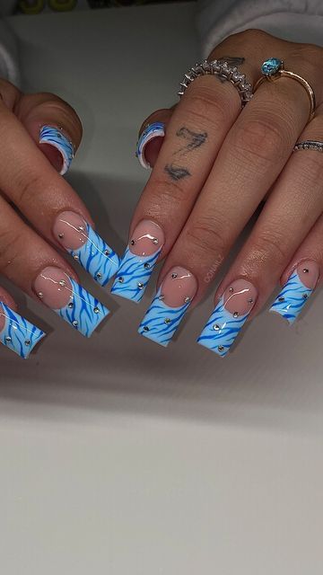 Light Blue Y2k Nails, Sza Singer Nails, Baby Blue Birthday Nails, White And Blue Aura Nails, Blue Tiger Nails, Airbrush Blue Nails, Baby Blue French Tip Nails, Blue Y2k Nails, Blue Birthday Nails