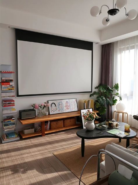 Hung Tv Living Room, Sofa Blocking Fireplace, Small Living Room Without Tv, Small Living Room Projector Ideas, Projector In Living Room Set Up, Small Space Tv Stand Ideas, Apartment Projector Setup, Projector Living Room Apartment, Projector From Ceiling