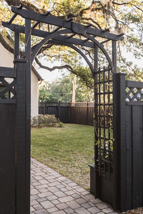 Arbor Fence Ideas, Black Garden Arbor, Fence With Arbor And Gate, Front Yard Trellis, Farmhouse Fence Ideas Front Yards, Diy Arbor Trellis, Beach Chateau, Black Wood Fence, Black Arbor