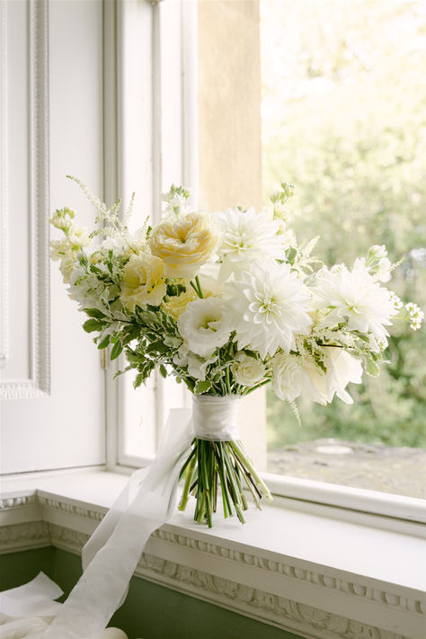 A soft, romantic bridal bouquet created from ruffly yellow garden roses, the last of the autumn dahlias and airy astilbe. Wedding Flowers Daffodils, Pale Yellow Bouquet, White And Yellow Bouquet Wedding, Pale Yellow Bridal Bouquet, Yellow Roses Wedding Bouquet, Pale Yellow Wedding Flowers, Butter Yellow Wedding Theme, White And Yellow Flower Arrangements, Light Yellow Wedding Theme