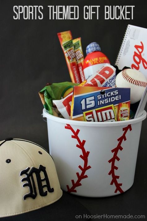 Personalize your gift giving with this Sports Themed Gift Bucket! Perfect for Father's Day, Birthdays, even a gift for the coach! Click on the photo to grab the instructions! Fathers Day Gift Basket, Homemade Gift Baskets, Christmas Gift Baskets Diy, Raffle Basket, Baskets For Men, Gift Baskets For Men, Raffle Baskets, Themed Gift Baskets, Diy Gift Baskets