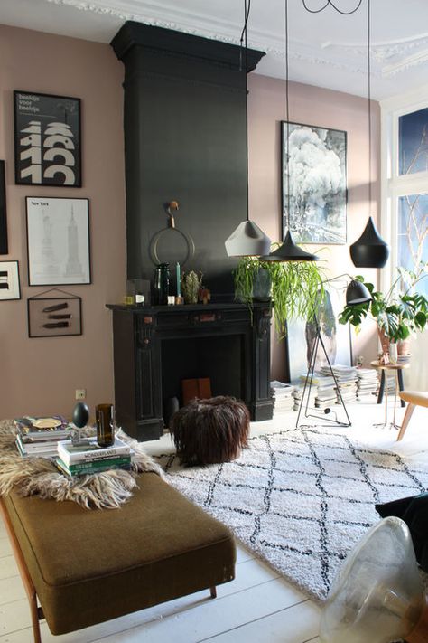 Pink walls in this eclectic living room look amazing next to the black chimney breast and the black and white art. Modern Moroccan Living Room, Black Chimney, Chimney Decor, Happy Family Life, Pink Living Room Decor, Black Fireplace, Chimney Breast, Pink Living Room, Eclectic Living