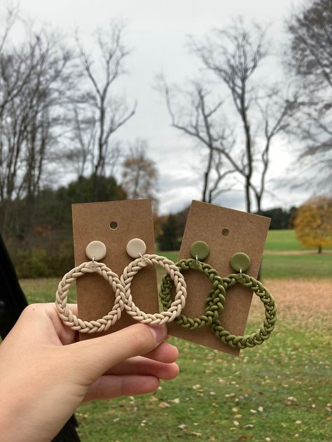 These super cute statement piece earrings are perfect for any occasion. Their formal but simple at the same time! The braided circle connected to the stud earring is a secure way to hold on the loop so no worries!  The two vibrant colors we offer them in are Mustard Yellow, and Olive Green. But of course if there's any other colors you have seen from other earrings or that you just want to have, contact us and we will talk with you on getting that done.  Keep in mind that these are made of clay Cute Fall Clay Earrings, Thanksgiving Clay Earrings, Clay Earring, Knit Clay Earrings, Knit Pattern Clay Earrings, Sweater Knit Polymer Clay Earrings, Knitted Clay Earring, Olive Green Polymer Clay Earrings, Mustard Clay Earrings