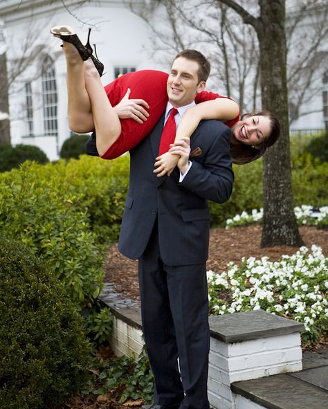 engagement photo of the happy couple - the fiance is carrying his fiancee over his shoulder - photo by North Carolina based wedding photographers Cunningham Photo Artists Holding Someone Over Shoulder Reference, Over The Shoulder Carry Couple, Princess Carry Pose Reference Drawing, Thrown Over Shoulder Pose Couple, Carrying Someone On Shoulders Pose, Carried Over Shoulder Couple, Boy Carrying Girl Over Shoulder, Carrying Over Shoulder Pose Reference, Carry On Shoulder Pose