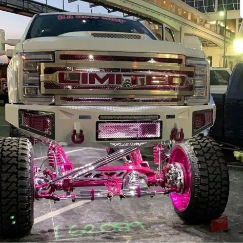 Pink Lifted Chevy Trucks, Huge Lifted Trucks, Pink Gmc Truck, Hot Pink Truck, Big Trucks Lifted, Pink Ford Truck, Lifted Trucks With Led Lights, Big Lifted Trucks, Raised Trucks