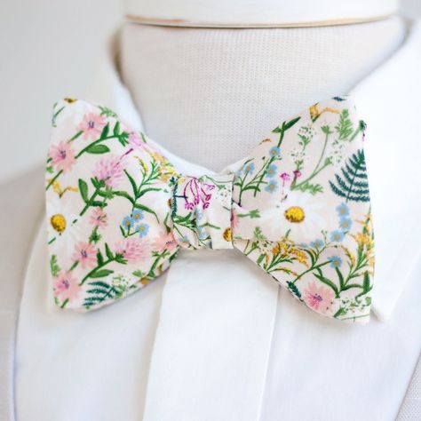 "Dapper Men's Wildflowers In Pink Freestyle Self-Tie Bow Tie Made By The Belle And The Beau! ♥ This beautiful cotton floral fabric is part of our new Wildwood Collection designed by Rifle Paper Co! We have been approved by Rifle Paper Co to make our products in these fabrics- that means we will be ordering bolts regularly! Yay! Our extraordinary, modern, and stylish freestyle self-tie bow ties are perfect for everyday, Sunday best, all special occasions, photography sessions, and especially dapp Bowties Men's, Floral Bow Tie, Suits Men, Wedding Plan, Pre Tied Bow Tie, Boys Bow Ties, Wedding Order, Wildflower Wedding, Wedding Ties