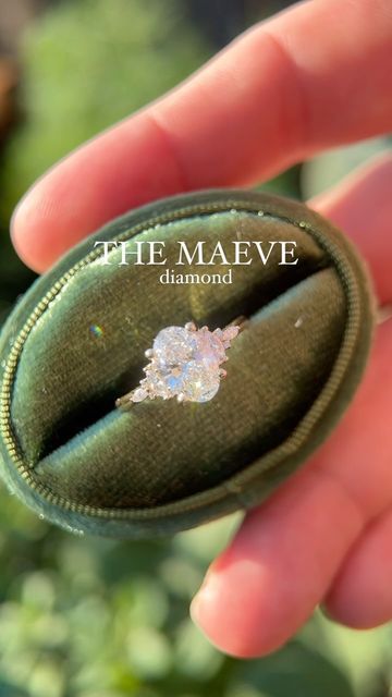 Brianna Trudell on Instagram: "(SOLD) My diamond Maeve is here! This ring features a 1.52 CT E, VVS2 lab grown diamond, and is set with natural diamond accents, in 14K yellow gold ✨ Available Friday! I would love to feature all of my designs with diamonds—yay or nay, my good people! #uniquejewelry #vintageengagementring #uniqueengagementring #lavendercreekgems #jewelrydesigner #ovaldiamond #engagementring #engaged" The Maeve Diamond, Maeve Diamond Ring, The Maeve Engagement Ring, Maeve Engagement Ring, The Maeve Ring, Diamond Cuts Chart, Engagement Rings Colored Stones, Maeve Ring, Low Setting Engagement Ring