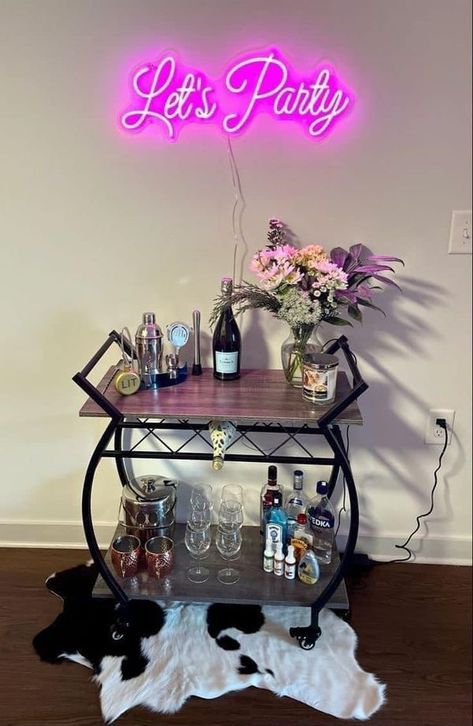 Solid Foundation Travels Neon Sign Above Bar Cart, At Home Bar Cart Ideas, Home Barcart Ideas, Bar Cart Room Ideas, Mini Bar In Apartment, Wine Bar Cart Ideas, Neon Signs Bedroom Decor Ideas, Neon Sign Bar Cart, Wine Cart Decor Ideas