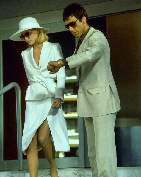 Elvira Hancock & Tony Montana in Scarface ⠀⠀⠀⠀ .⠀⠀⠀⠀ .⠀⠀⠀⠀ .⠀⠀⠀⠀ .⠀⠀⠀⠀ #tonymontana #michellepfeiffer #scarface #alpacino #theworldisyours #mafia #organizedcrime #mademan #wiseguys #gangsters #gangster #gangstermovies Elvira Hancock, Scarface Movie, Tony Soprano, Mode Chanel, Tony Montana, White Suit, Michelle Pfeiffer, Movies Outfit, Al Pacino