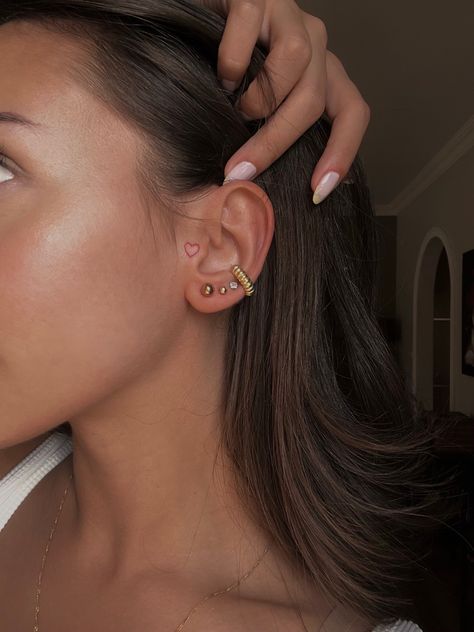 Ear Piercing Tattoo Ideas, Begging Ear Tattoo, Small Tattoo By Ear On Face, Tattoo Behind Ear Girl, Minimal Tattoo Behind Ear, Heart In Ear Tattoo, Beside Ear Tattoo Women, Small Tattoos On Ear, Front Of The Ear Tattoo Ideas