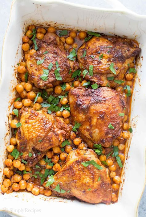 One pot easy baked chicken thighs with smoked paprika, onions, and chickpeas! You'll love how easily this dish comes together. So good! On SimplyRecipes.com Chicken With Chickpeas, Easy Baked Chicken Thighs, Thighs Chicken, Recipes Oven, Paprika Chicken, Easy Baked Chicken, Chickpea Recipes, Baked Chicken Thighs, Thigh Recipes