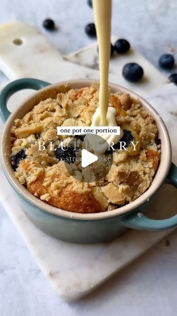 Eleanor Wilkinson on Instagram: "🫐One Pot One Portion | Blueberry Streusel Cake🫐

The baking collab for all your single serve dessert needs!! Follow @foodbyremi for more delicious baking (and non baking) recipes, and @eleanorgwilkinson for more one pot one portion recipes 🫶🏼

If you ask us, this could be the perfect pudding! Warm cake, fresh blueberries, crunchy streusel and lashings of custard- THE DREAM! We’ve made one of Remi’s most popular cakes into the perfect pud for solo cooks. The full recipe is below or you can check out Remi’s website for the full cake recipe, link in the bio🤍

For more One Pot One Portion recipes make sure to check out Eleanor’s new cookbook, link in the bio✨

Cake
- 10g/ 2 tsp butter
- 1 1/2 tsp vegetable oil
- 1/4 tsp vanilla
- 15g/1 tbsp milk
- 1 egg yo Mini Casseroles, Streusel Cake, Berry Picking, Single Serve Desserts, Warm Cake, New Cookbooks, Mug Cake, Baked Goods, Summer Recipes