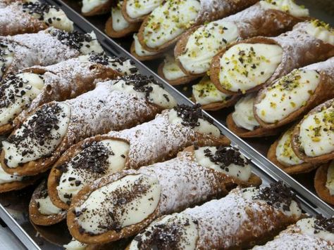 One of Sicily’s most famous exports is undoubtedly cannoli, deep-fried pastry tubes piped full of fresh, creamy ricotta. Every town boasts a unique style of cannoli that claims to be king. Two that stand out are Piana degli Albanesi, where Extra Bar makes traditional cannoli on the sweeter side with extra sugar and candied fruit and chocolate crumbs, and Dattilo’s Euro Bar. There, chefs bake massive, super crunchy shells that are roughly the size of a sandwich plate and then overstuff the pastries with thick homemade ricotta. Sicilian Food, Chocolate Crumbs, Italian Bakery, Rainbow Cookies, Sicilian Recipes, Morning Snack, Famous Recipe, Mexican Dessert, Cannoli