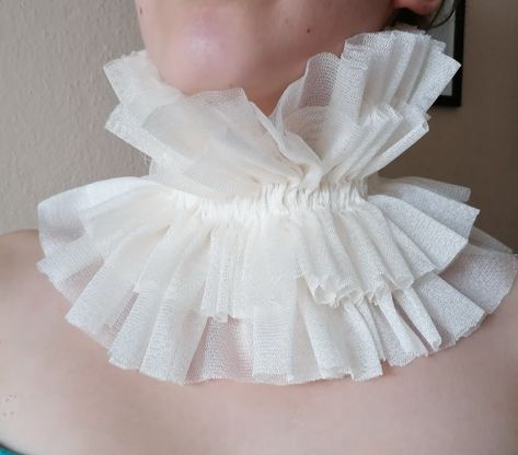 HANDSEWN Renaissance inspired Handmade chic ruffled tulle collar. ribbon ties can be worn at the front or back of the neck detachable neck collar for women. Ivory beige cream color. I couldn't find the name of this color. approximate dimensions COLLAR: minimum 12" length 31cm. high 7-8" adjustable with laces Please feel free to ask questions for any shape changes about the product One size fits all. adjustable with laces ALL MY COLLARS: https://www.etsy.com/shop/damlace?ref=seller-platform-mcnav§ion_id=33170178 Please check your registered address on Etsy is up to date before purchasing EXSPRESS SHİPPİNG: need PHONE NUMBER Express shipping option available for countrys.You can see it when you buy and select your country We recommend you to send your phone number with a message in the fast Ruffle Neck Design, Elizabethan Ruff, Neck Ruffle Collar, Ruff Collar, Fake Collar, Bib Collar, Ruffle Collar, Neck Ruffle, Collar Pattern