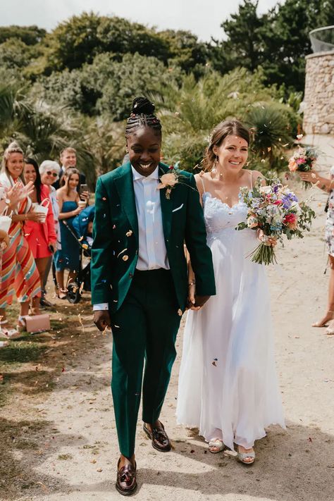 Lesbian multicultural wedding at Tremenheere Sculpture Gardens with local flowers and bridesmaids suits, shot by Jessica Hopwood Photograhy. Suits For Lesbian Wedding, Womens Suit For Wedding, Green Suit Wedding Women, Green Suit Women Wedding, Women In Wedding Suits, Lesbian Tuxedo Wedding, Masc Fem Wedding, Women’s Suit Wedding, Green Suit For Women Wedding