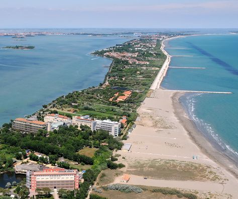 The Lido — or Venice Lido (Lido di Venezia) — is an 11 km long sandbar located in Venice, northern Italy, home to about 20,000 residents. The Venice Film Festival takes place at the Lido every September........................via camilliani.org Venice Italy Beaches, Around The World Cruise, Venice Lido, Best Family Resorts, Italy Beaches, Lido Beach, Venice Hotels, Italy Home, Italy Holidays