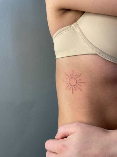 Sun On Ribs Tattoo, Sunshine Rib Tattoo, Sun Ribcage Tattoo, Single Needle Sun Tattoo, Sun Tattoo Ribcage, Rib Sun Tattoo, Sun Tattoo On Ribs, Minimal Tattoo Sun, Sun Tattoo Hip