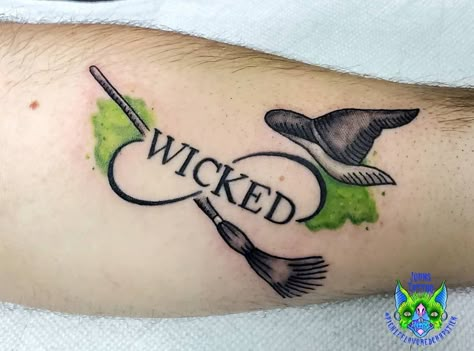 Wicked The Musical Tattoo, Wicked Musical Tattoo Ideas, Wicked Witch Tattoo, Witch Hat Tattoo Ideas, Elphaba Tattoo, Witches Hat Tattoo, Wicked Tattoos Musical, Salem Tattoo Ideas, Sand Timer Tattoo