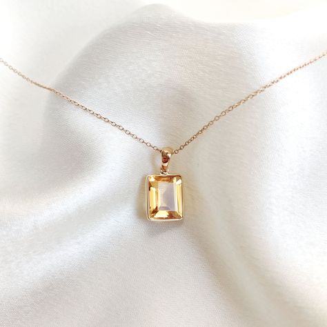 This stunning Pendant is set in 14k Solid Yellow Gold with Natural Citrine with utmost precision. It is a unique gemstone Pendant for nearly every occasion and is completely hassle-free jewelry. ITEM DETAILS: * Gem: Citrine * Gem Size: 9X11mm * Gem Shape: Octagon * Gem Weight: 4.30 carats * Gold Purity: 14KT * Gold Weight: 0.54 gram * Total Weight of the Pendant: 1.40 gram The Gold purity is guaranteed and it comes with authentic 14KT gold hallmark. Since my items are handmade, they are absolutely nickel and lead free. CUSTOMIZATION: * Gemstone customization is available and it can be substituted with a gem of your choice. Kindly message me for the same. PACKAGING * The Pendant comes with layers of safe and secure wrapping along with Free handmade jewelry box with every purchase. ➡️Head to Sunny Disposition, Yellow Hues, Handmade Jewelry Box, Tanzanite Earrings, Citrine Jewelry, Air Bnb, Citrine Pendant, Personalized Pendant, Bezel Pendant