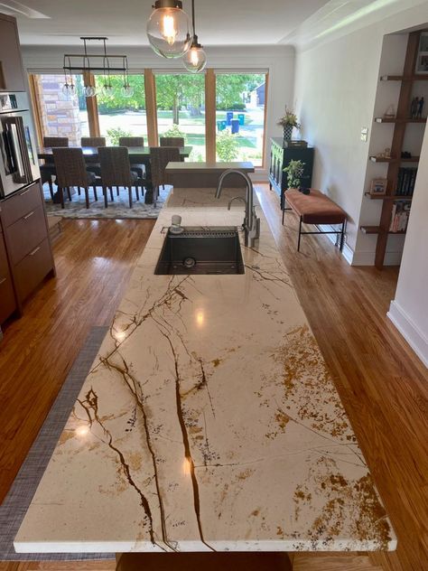 Roma Imperial Granite is exotic and stunning. The granite features a creamy white background with golden brown veins. 

#romaimperialgranite #uniquegranite #granitekitchen #granitecounter #granitecountertop #whitegranite #kitchendesign #kitchenideas #kitcheninspo #modernkitchen #kitchenisland #kitchenislandideas #longkitchenisland White Countertop With Gold Veins, White Granite With Brown Veins, White And Brown Granite Countertops, Herringbone Backsplash Kitchen, Kitchen Remodel Trends, Creamy White Background, Bathroom Granite, Kitchen With Long Island, Granite Worktop Kitchen