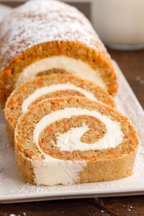 This carrot cake roll is spongy and warmly spiced, dotted with finely grated carrots, and layered with cream cheese filling for the perfect spring dessert rolled and sliced into a fun swirled design! Spicy Carrot Cake, Carrot Cake Roll, Pumpkin Roll Cake, Pumpkin Rolls Recipe, Easy Easter Treats, Carrot Spice Cake, Cake Roll Recipes, Easter Desserts Recipes, Pumpkin Caramel