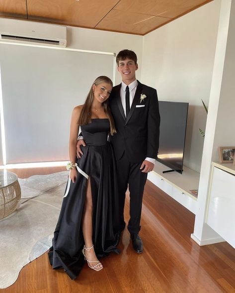 Black Suit And Black Dress Couple, Winter Ball Couple Outfits, All Black Couple Outfit Formal, Black Prom Dress Matching Suit, Couple Ball Outfit, Black Dress And Suit Couple, Black Prom Dresses Couple, Black Formal Couple Outfit, Gala Couple Outfit