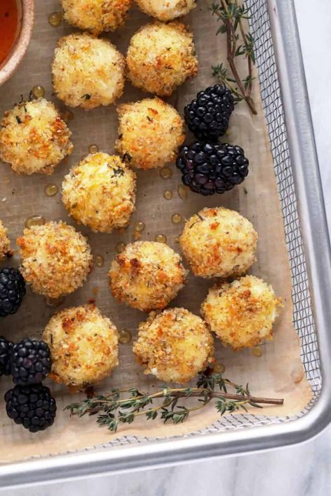 Seriously delicious Baked Goat Cheese Balls that are creamy on the inside and crunchy on the outside. Top them with a drizzle of honey and enjoy! Goat Cheese Bites, Goat Cheese Balls, Honey Sriracha Sauce, Fried Goat Cheese, Baked Goat Cheese, Spicy Dip, Goat Cheese Recipes, Goats Cheese, Delicious Appetizer Recipes