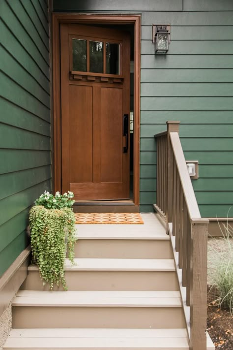 Painted dark green with lighter green accents, a classic Craftsman palette, this home has a natural feel from the front door all the way through to the interior and out to the backyard. Renovated Craftsman, Green House Exterior, Green Siding, Green Front Doors, Craftsman Style Home, Exterior Paint Colors For House, Craftsman Style Homes, Casa Exterior, Front Door Colors