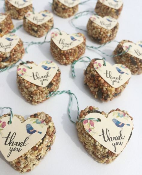 "40 mini-bird seed wedding or party favors. Each favors measures approx 1.5\" x 1.5\", and are approx .75\" in height. Bird seed favors come 3 different ways and you choose how you want them from the drop down before you checkout: 1. Seed cake only - Choose this option if you don't want tags or string included. This option allows you to string and adorn the favors how you want. Also, a great option for those on a budget. If ordering cakes only, you will choose the \"CAKES ONLY\" string color opt Woodland Shower Favors, Cottagecore Party Favors, Woodland Baby Shower Party Favors, Woodland Baby Shower Favors For Guests, Bird Seed Wedding Favors, Baby Shower Guest Gifts, Bird Baby Shower Theme, Bird Seed Favors, Baby Shower Favors For Guests